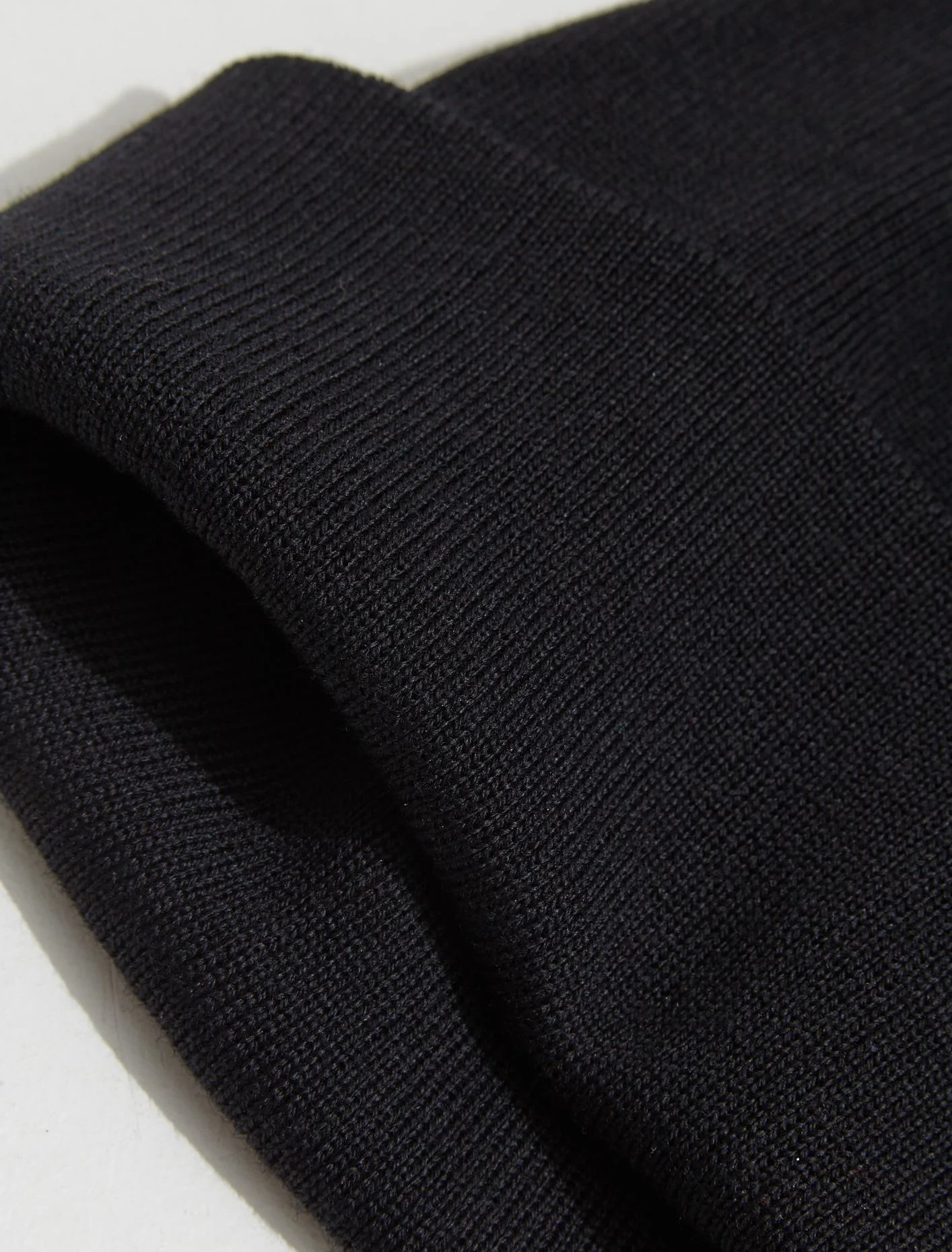 Fine Knit Merino Wool Beanie in Black - Image 4